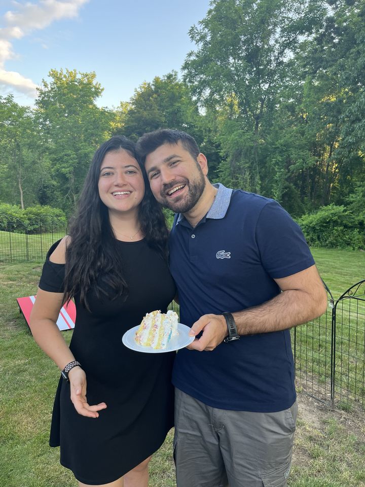 Jessica and Rami sharing a slice of cake