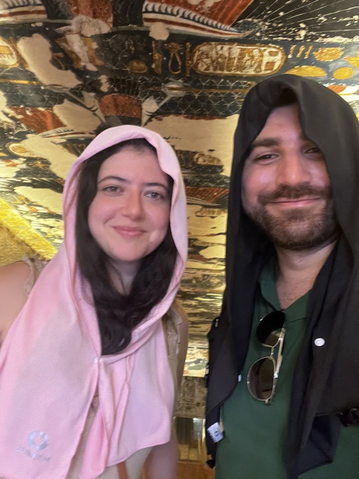 Jessica and Rami inside a painted ancient Egyptian tomb