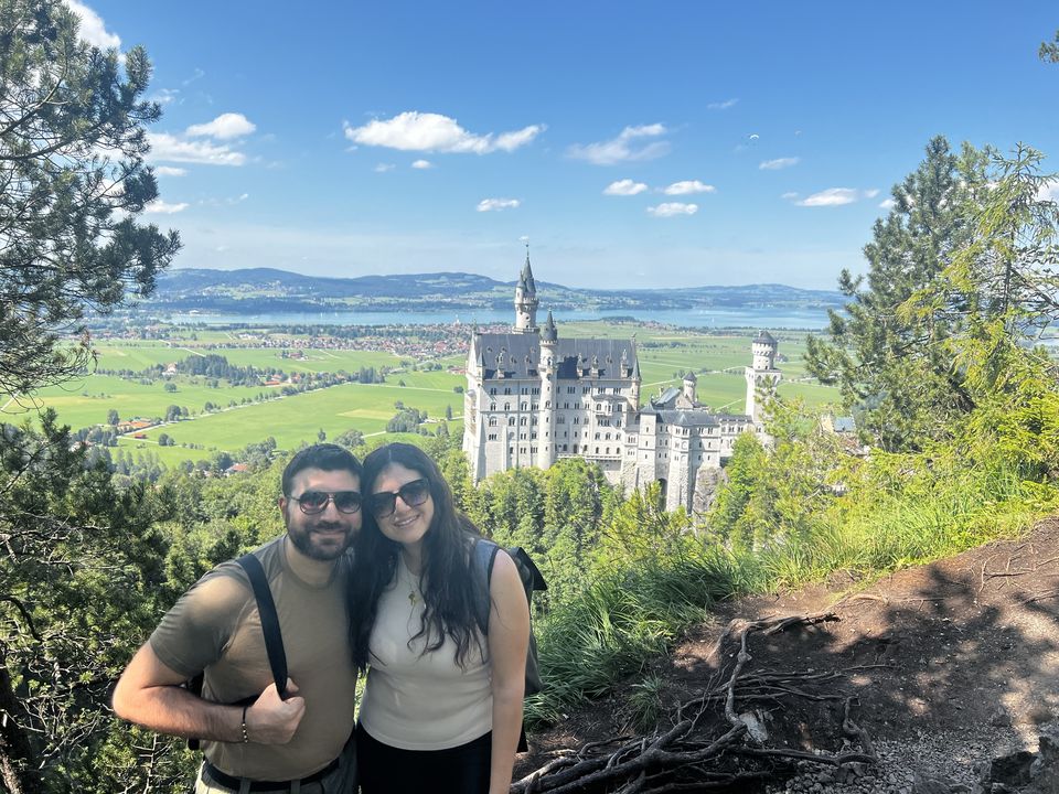 Jessica and Rami with Neuschwanstein Castle behind them