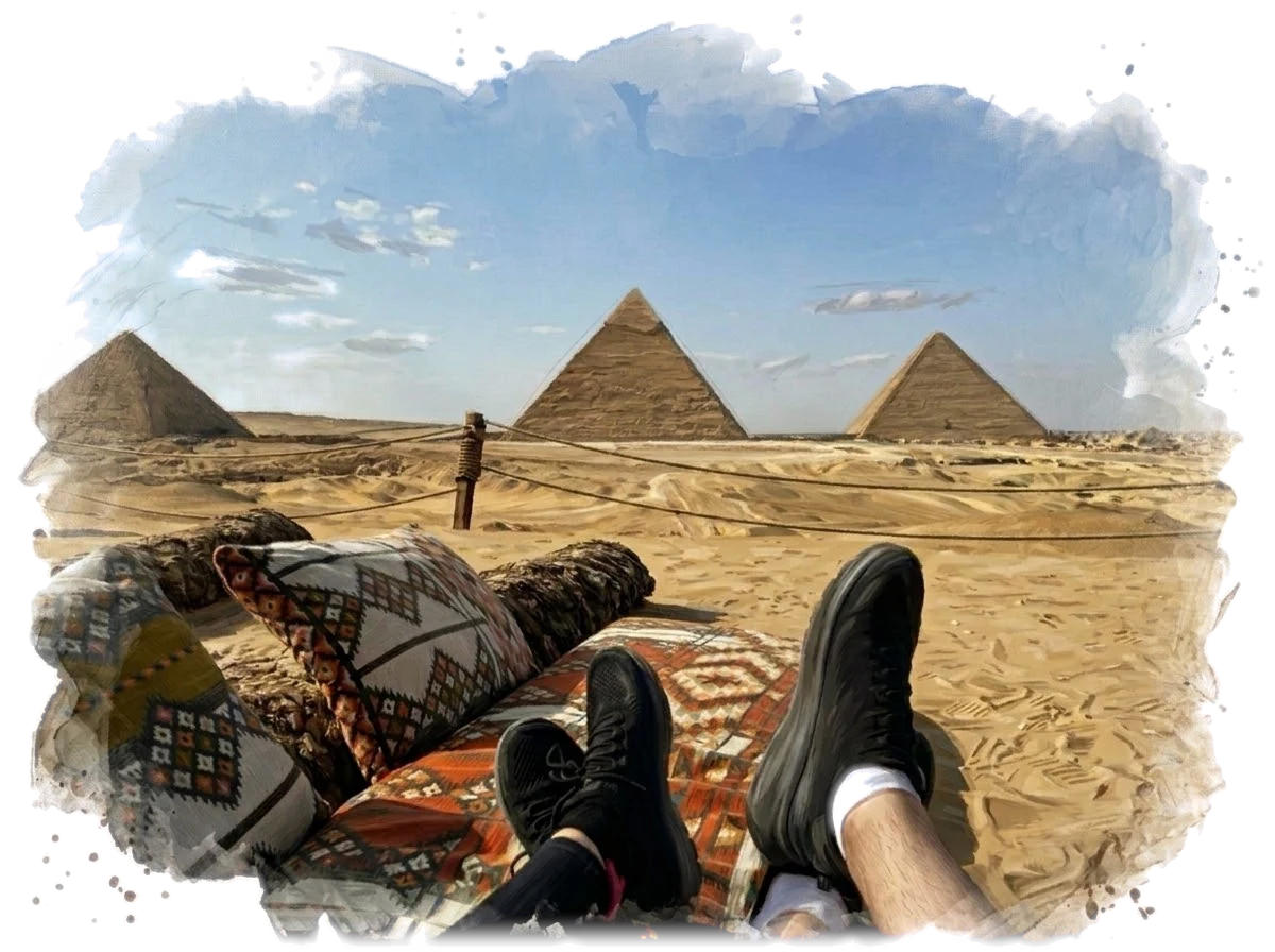 Our feet up on patterned cushions facing the three pyramids of Giza, painted in watercolor